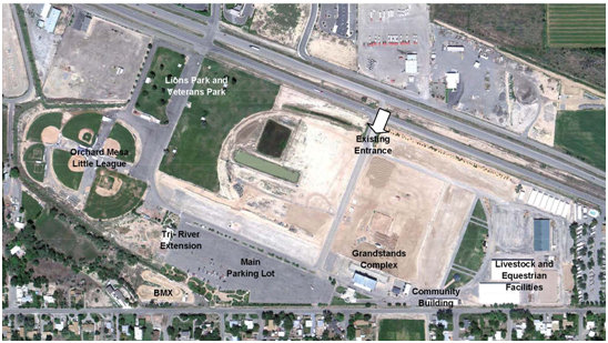 Aerial photograph of Current Layout of Mesa County Fairgrounds showing Lions and Veterans Park, existing entrance, Orchard Mesa Little League, Tri-River Extension, Main parking lot, Grandstands Complex, Community Building Livestock and Equestrian Facilities, BMX track