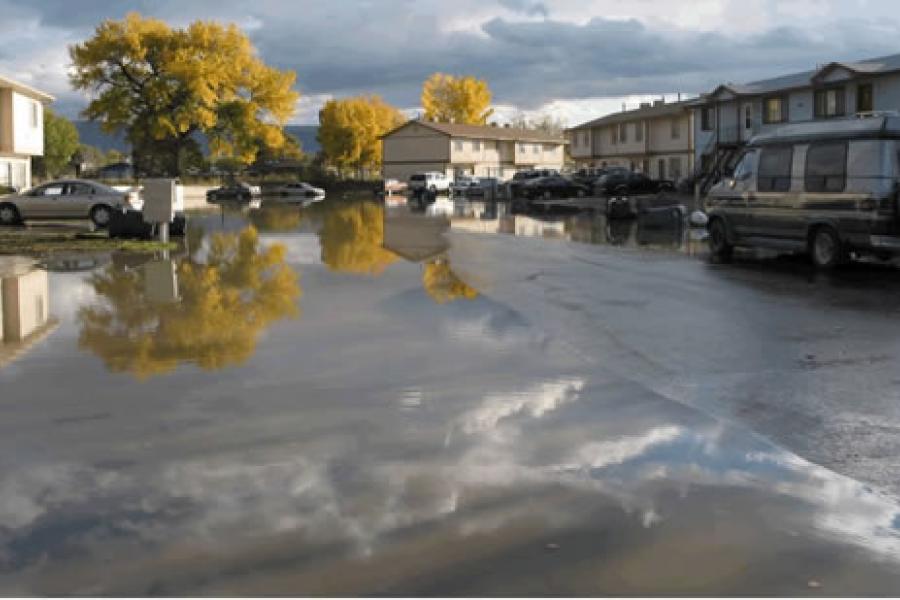 Photograph of Flooded Apartment Complex parking lot