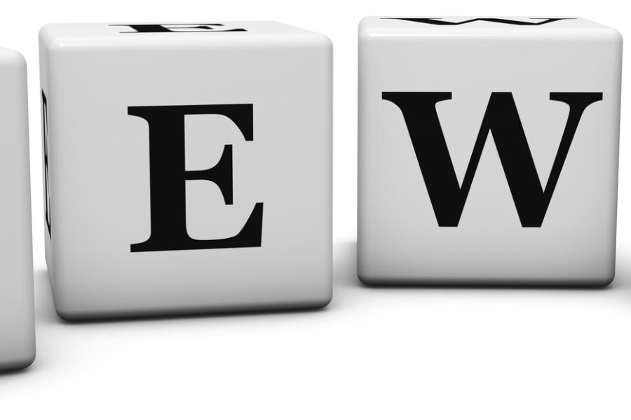 Concept photograph for News.  Word on cubes on white background