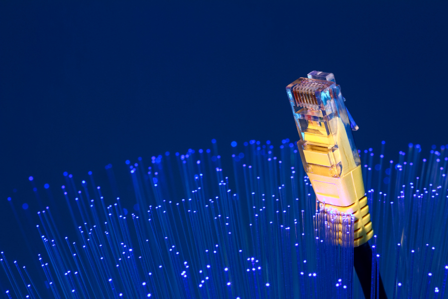 Yellow chord sticks out from blue broadband fibers.