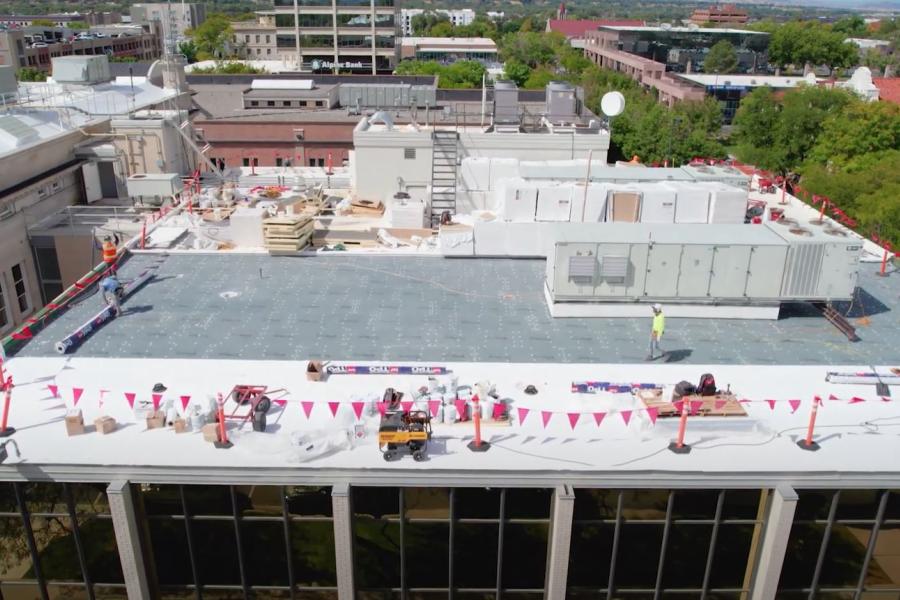 Aerial view of Mesa County Old Courthouse roof with red caution flags.