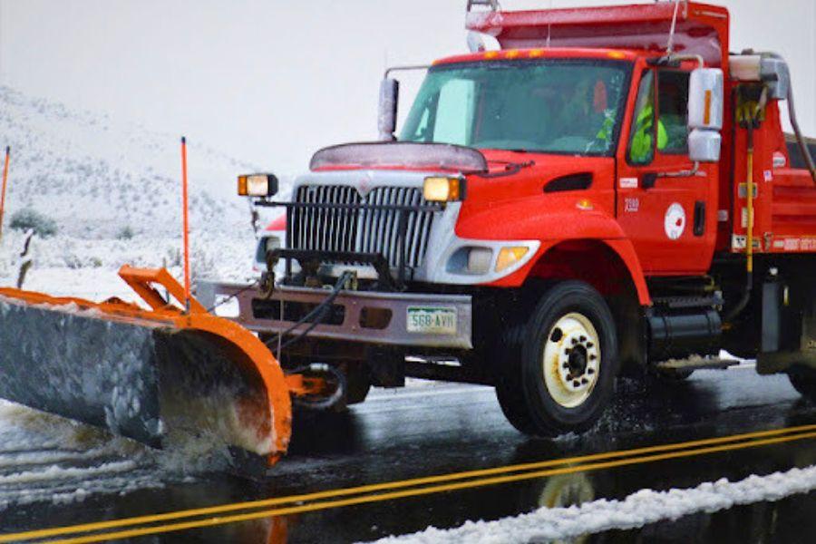 Red Mesa County snow plow. 