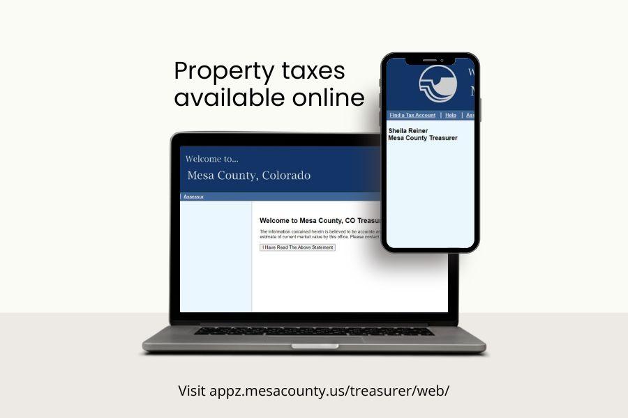 Computer screen and smart phone displaying blue website to pay property taxes. 