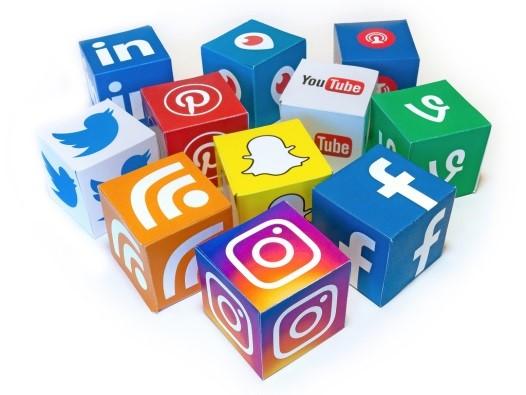 Social Media Logo with cubes containing icons for social media platforms like Facebook, Twitter, Instagram, Snap Chat, YouTube, Pintrest, RSS feeds, Linked In, Vimeo, 
