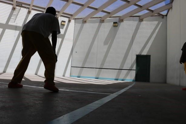 Photograph of an inmate in the exercise yard of Detention center