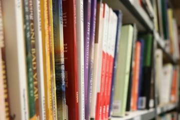 Photograph of books on a shelf in the Detention Facility Library