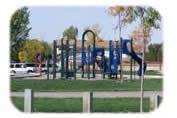 Photograph of playground equipment and grass field at Kimwood Park 