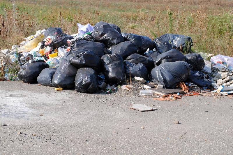 Illegal Dumping - Bags of Trash thrown on side of road