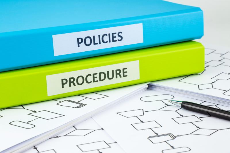 Concept photograph for Policies and Procedures. Photograph of binders and blank flow charts.