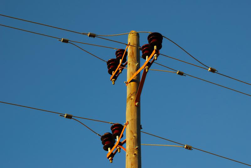 Photograph of Power Lines on Pole with blue sky