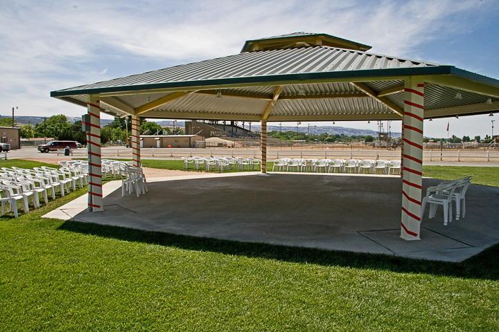 Photograph of gazebo with chairs around at Exposition Park