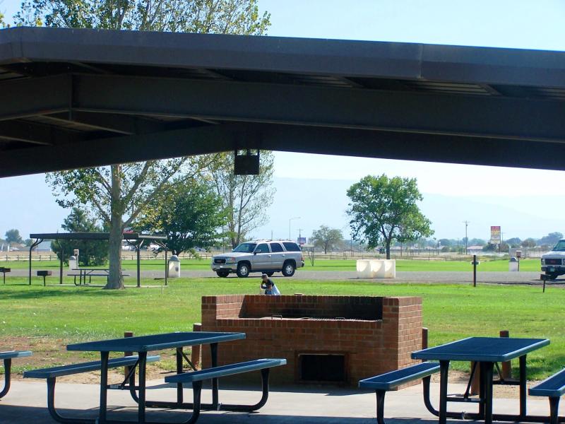 Photograph of Orchard Mesa Lions Club park shelter with table and barbeque