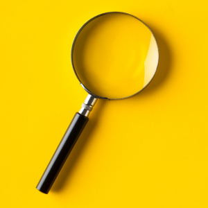 magnifying glass on a yellow background
