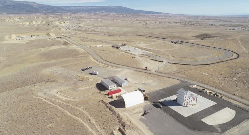 The Colorado Law Enforcement Training Center features a driving track, observation tower, a classroom building, shooting range, fire training area, and vacant houses for training.