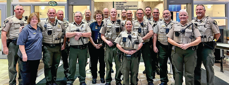 Mesa County Sheriff's Office Court Services Division stands in the lobby of the Mesa County Court House.