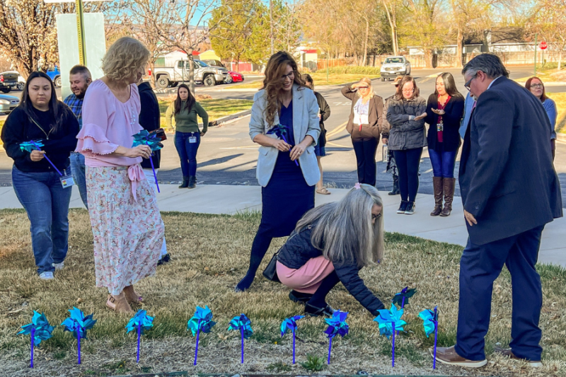Mesa County leaders plant blue pinwheel to bring awareness to Child Abuse Prevention Month 