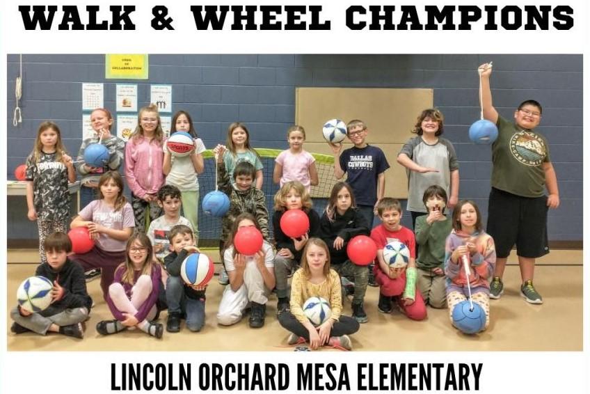 Lincoln Orchard Mesa Elementary students showing off their new recess equipment after winning the top prize for the Mesa County Safe Routes to School Fall Walk and Wheel Challenge.
