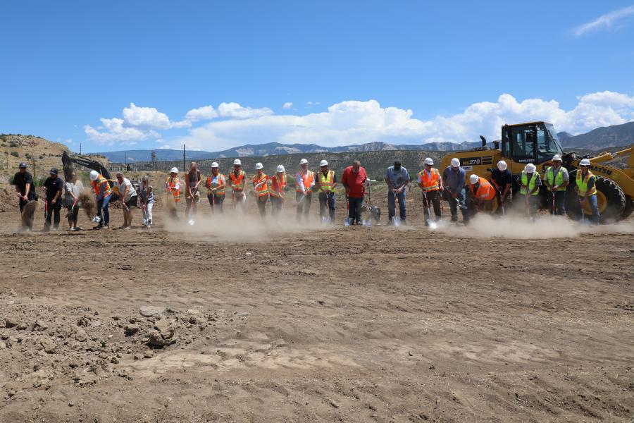 People gather around shovels to break ground on the De Beque Community Hall 